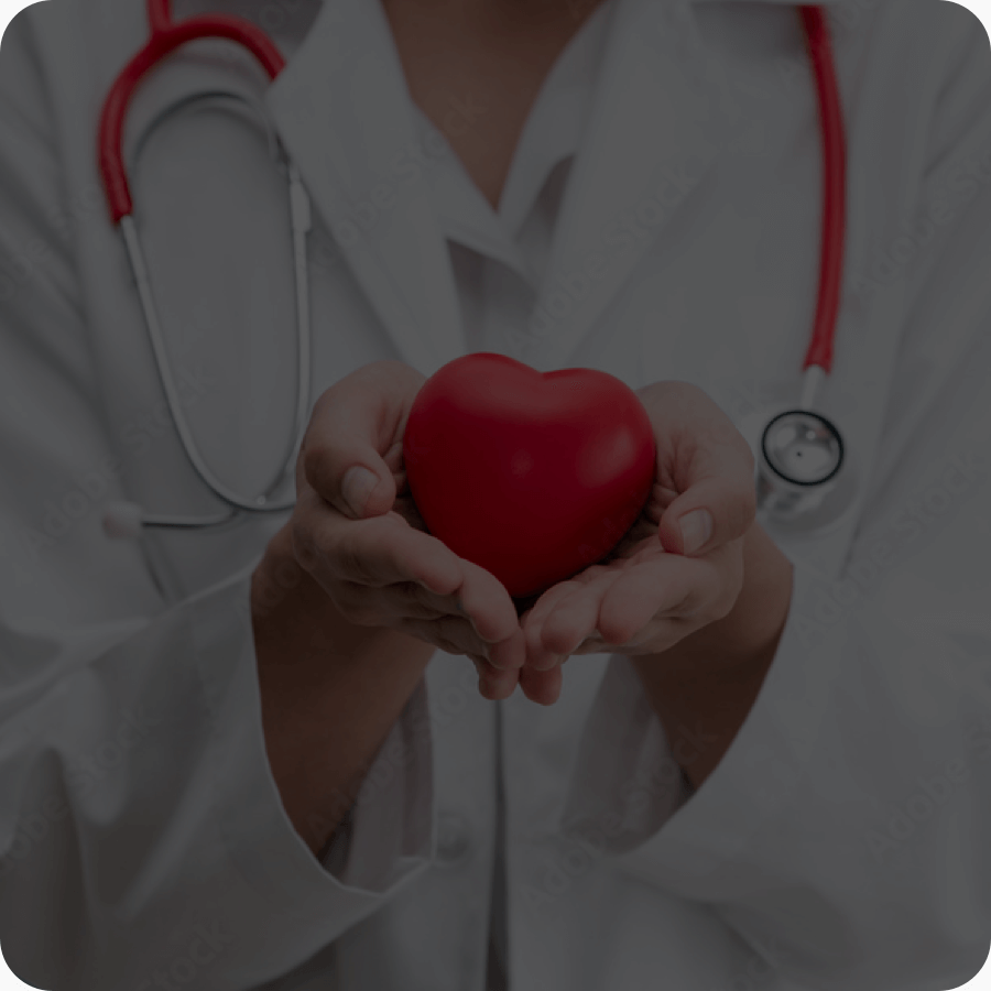 Photo of a doctor holding a heart-shaped object with her hands open to express caring