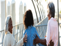 Three female friends walking together Approach - Community-Based Organizations
